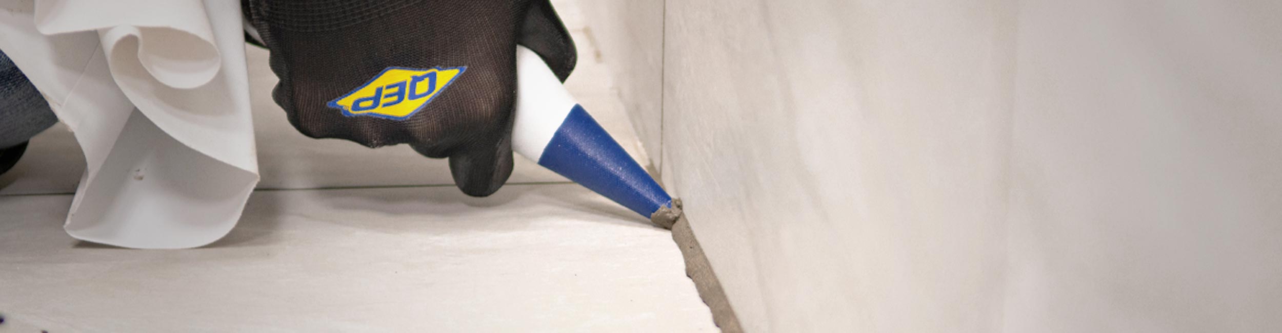 Close-up of QEP's Grout Bag being used to neatly install tile grout during installation