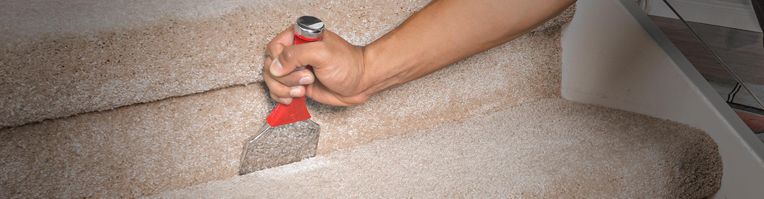 Installer using ROBERTS Professional Electric Stapler to tack down carpet padding