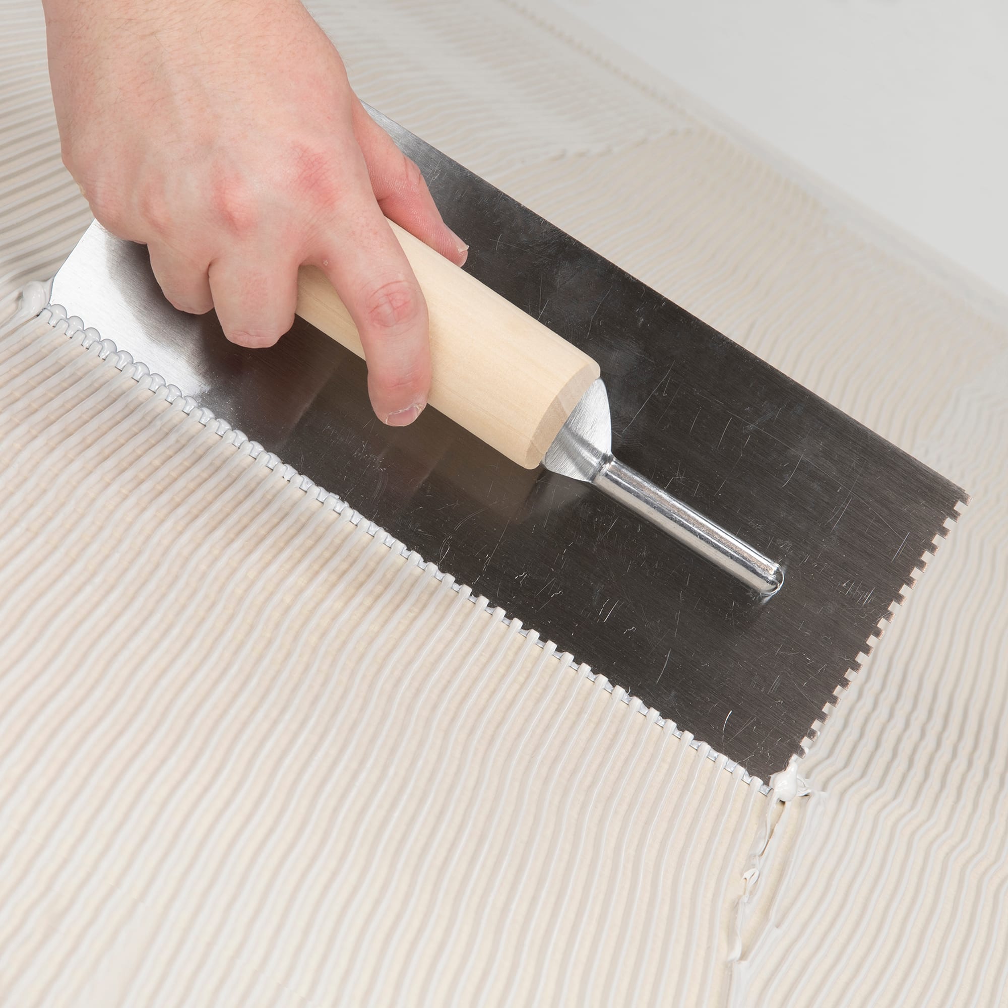 1/8" x 1/8" x 1/8" Square Notch Steel Pro Trowel w/ Wood Handle - 3
