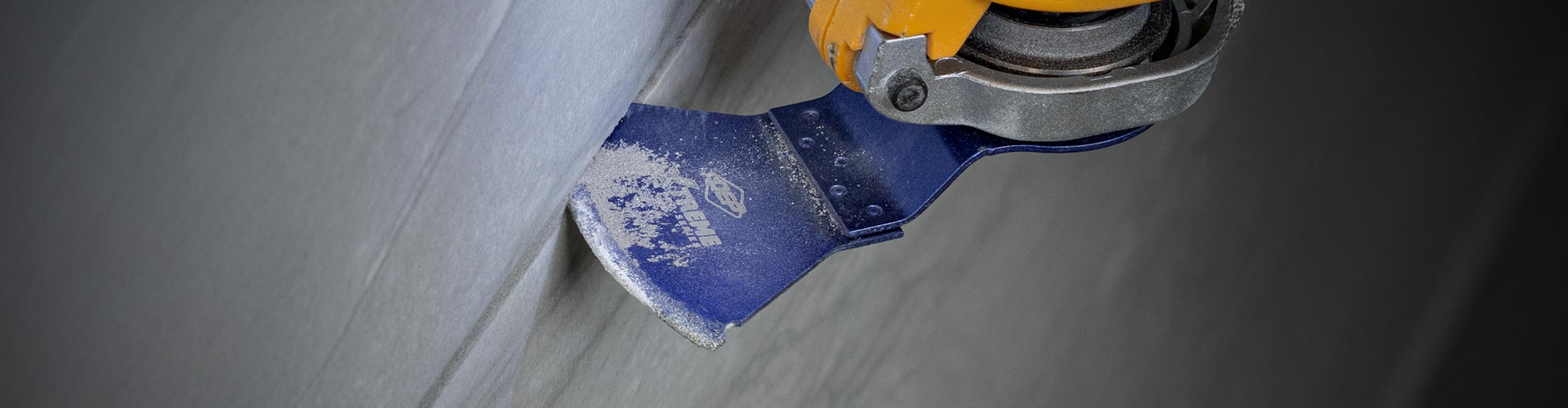 Close up of QEP's Diamond Grit Grout Removal Blade removing flooring grout